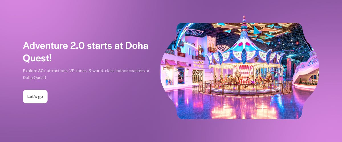 Carousel ride inside Doha Quest Theme Park with vibrant lights and architecture.